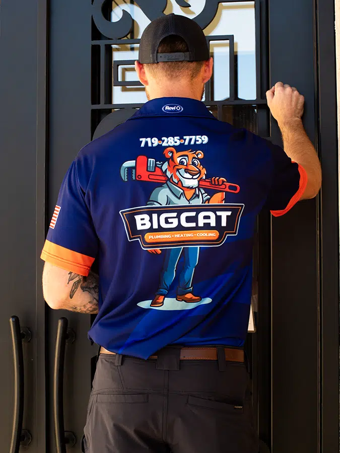 Big Cat Plumbing Heating and Cooling truck knocking on door in Colorado Springs area